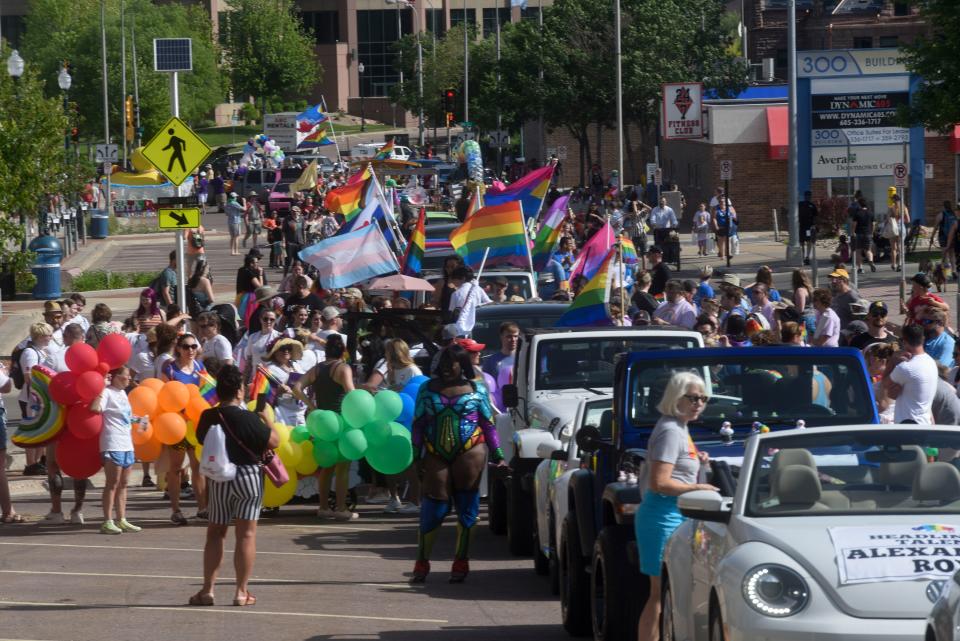 People gather for the Sioux Falls Pride parade in downtown Sioux Falls on Saturday, June 18, 2022.