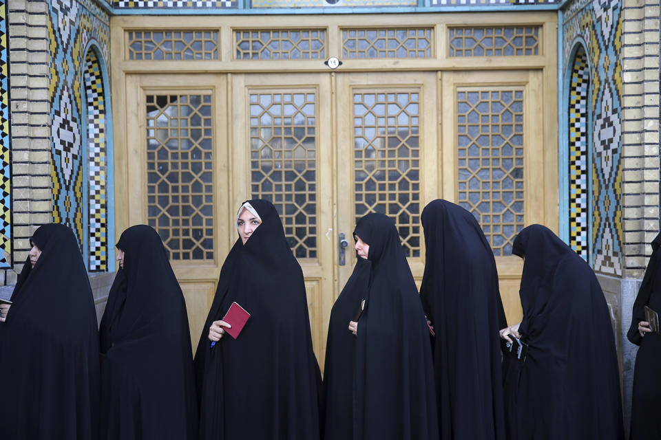 <p>Female voters queue at a polling station for the presidential and municipal council election in the city of Qom, 78 miles (125 kilometers) south of the capital Tehran, Iran, May 19, 2017. Iranians began voting Friday in the country’s first presidential election since its nuclear deal with world powers, as incumbent Hassan Rouhani faced a staunch challenge from a hard-line opponent over his outreach to the wider world. (Photo: Ebrahim Noroozi/AP) </p>