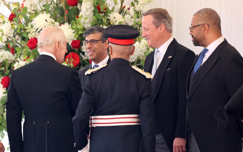 The King greets the Prime Minister and other members of the cabinet