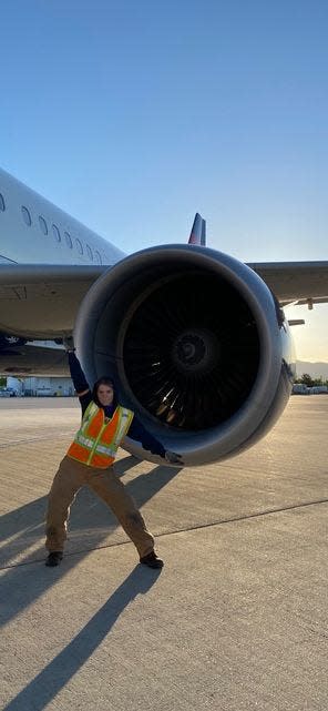 Rachel Bacha next to an airplane.