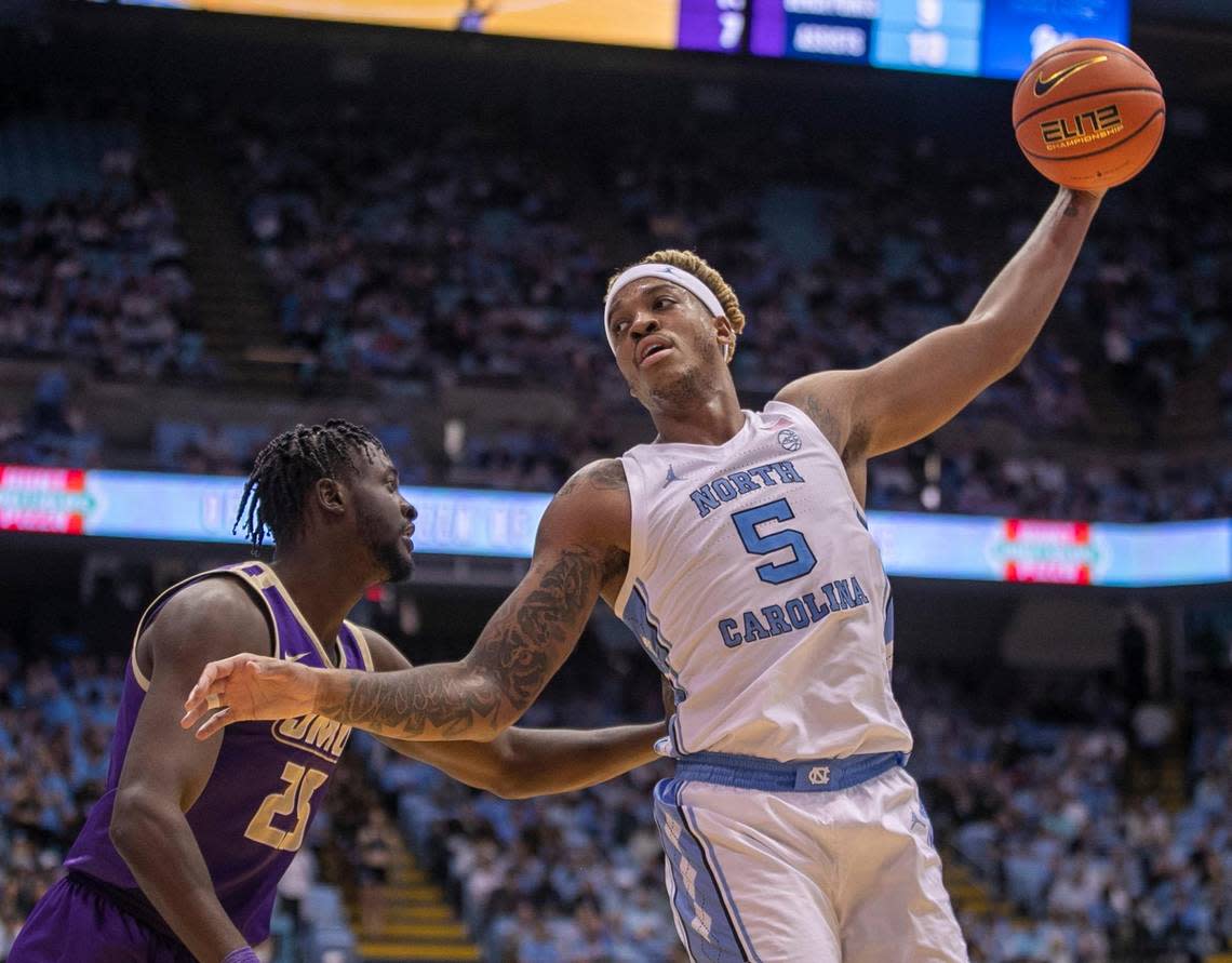 North Carolina’s Armando Bacot (5) works against James Madison’s Alonzo Sule (25) in the first half on Sunday, November 20, 2022 at the Smith Center in Chapel Hill, N.C.