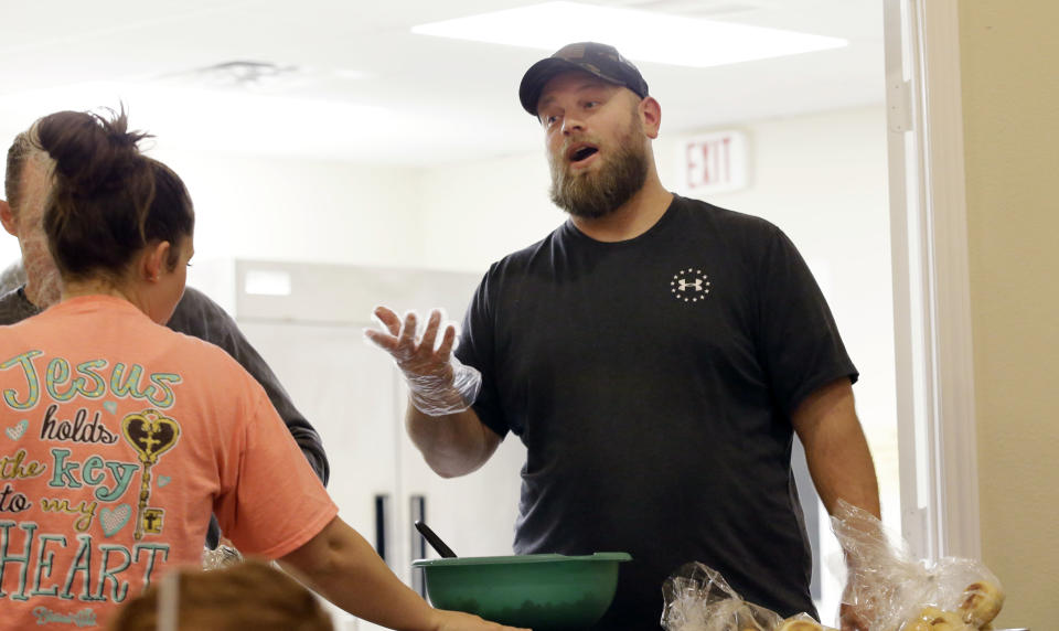 In this Wednesday, Dec. 7, 2016 photo, U.S. Army Veteran Richard Ress, right, speaks while he volunteers at his rural church in Grayson County, Texas. Ress participates in a traveling veterans court with Judge John Roach Jr. The traveling court serves veterans in five counties near Dallas who don’t have transportation. Veterans say the opportunity is life-changing. (AP Photo/LM Otero)
