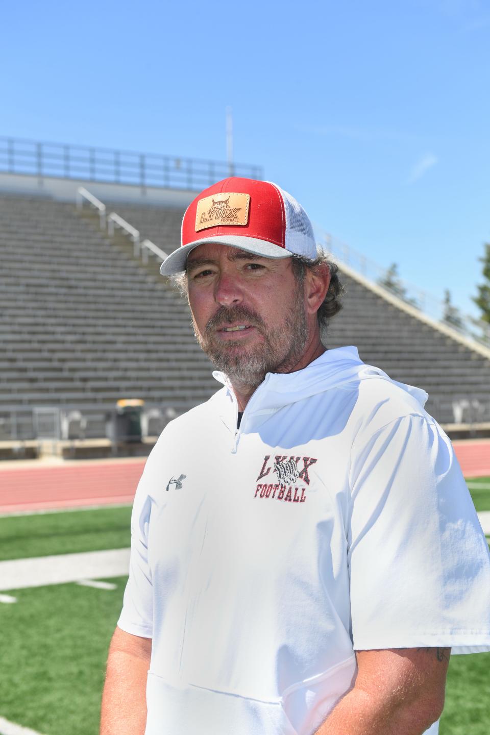 Brandon Valley football coach Chad Garrow stands for a portrait on Tuesday, August 11, at Howard Wood Field in Sioux Falls.