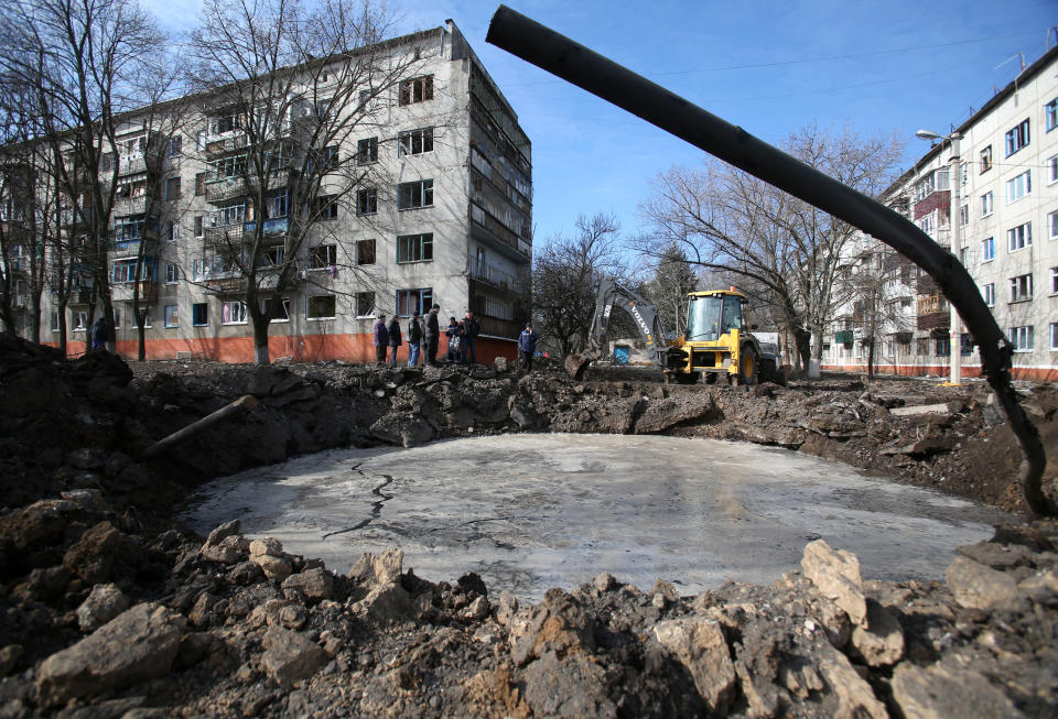 Communal services deal with consequences of what is said was an explosion of a ballistic missile in a residential area in Kramatorsk on March 14, 2022, following an overnight shelling amid the ongoing Russia's invasion of Ukraine. - The shelling killed 2 civilians, according to the local mayor. (Photo by Anatolii Stepanov / AFP) (Photo by ANATOLII STEPANOV/AFP via Getty Images)