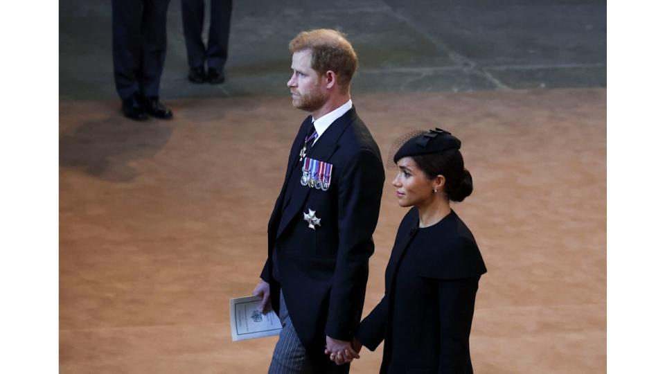Prince Harry and Meghan Markle walking hand-in-hand