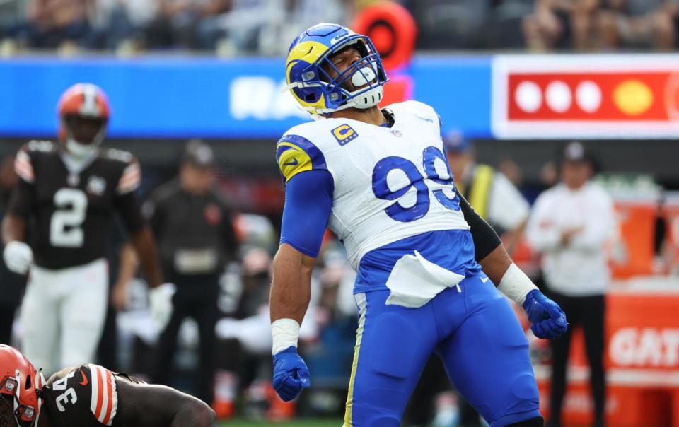 Rams Aaron Donald tackles celebrates his tackle of Cleveland Browns back Jerome Ford.