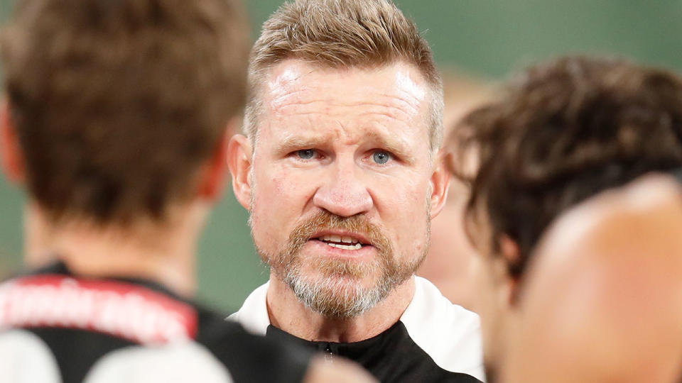 Pictured here, Collingwood coach Nathan Buckley addressing his players.