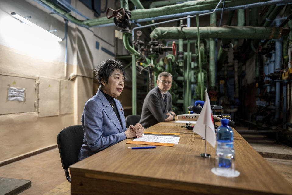 Japan's Foreign Minister Yoko Kamikawa, left, speaks to the media during a press conference with Ukraine's Foreign Minister Dmytro Kuleba at the bomb shelter in Kyiv, Ukraine, on Sunday, Jan. 7, 2024. (AP Photo/Evgeniy Maloletka)