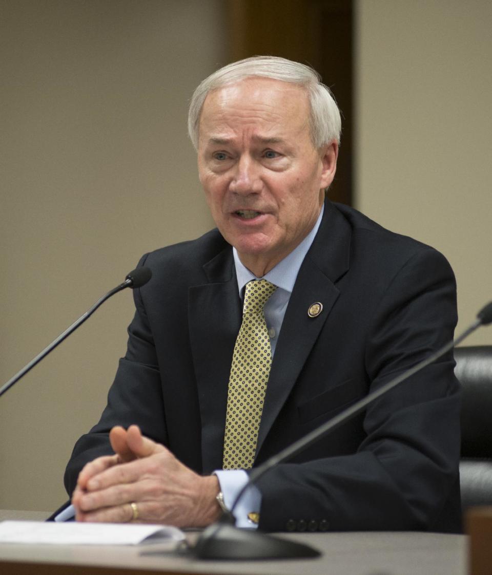 In this Wednesday, Jan. 4, 2017, photo, Arkansas Gov. Asa Hutchinson speaks to members of the press during a Q&A session in Little Rock. Arkansas is one of three states where civil rights leader Martin Luther King Jr. shares a holiday with Confederate General Robert E. Lee, an arrangement that once seemed clever to some political leaders here but that is now a public image problem. Hutchinson has revived an effort to remove Lee from the holiday, but the move is facing resistance from lawmakers of both parties – even including some black members. (AP Photo/Brian Chilson)