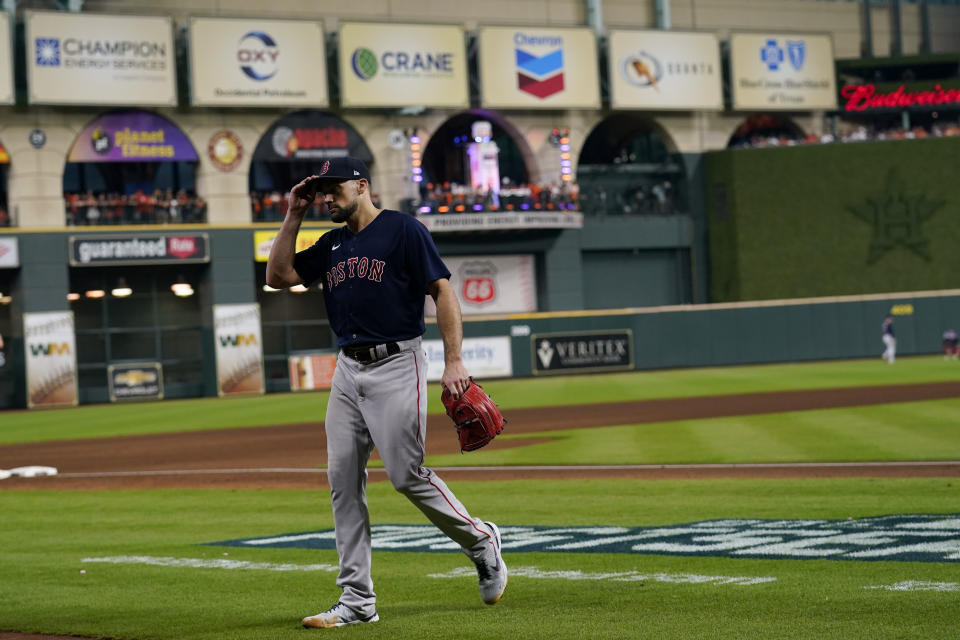 Boston Red Sox starting pitcher Nathan Eovaldi leaves the game against the Houston Astros during the sixth inning in Game 2 of baseball's American League Championship Series Saturday, Oct. 16, 2021, in Houston. (AP Photo/Tony Gutierrez)