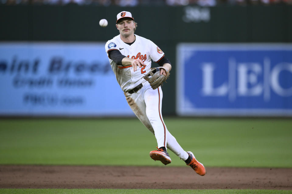 Baltimore Orioles shortstop Gunnar Henderson throws to first to put out Cleveland Guardians' Steven Kwan during the fifth inning of a baseball game, Monday, June 24, 2024, in Baltimore. (AP Photo/Nick Wass)