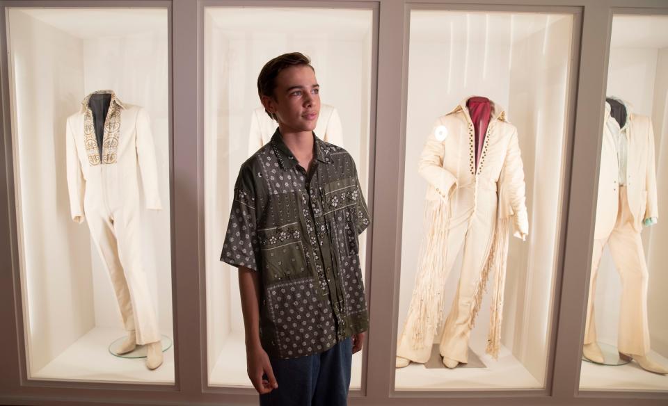 Chaydon Jay, the young Australian actor who plays the boy Elvis in the new biopic, poses in the 'Dressed to Rock' exhibit Friday, July 8, 2022, at Graceland in Memphis. The room features clothing from 1969-1977 worn by Elvis Presley. 