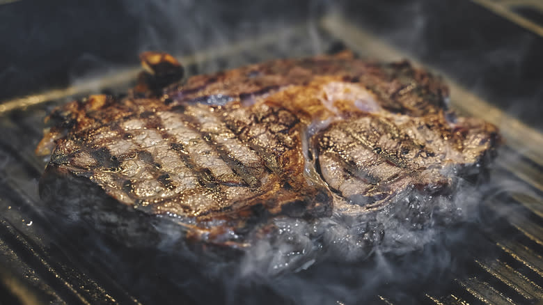 Searing steak on a hot griddle