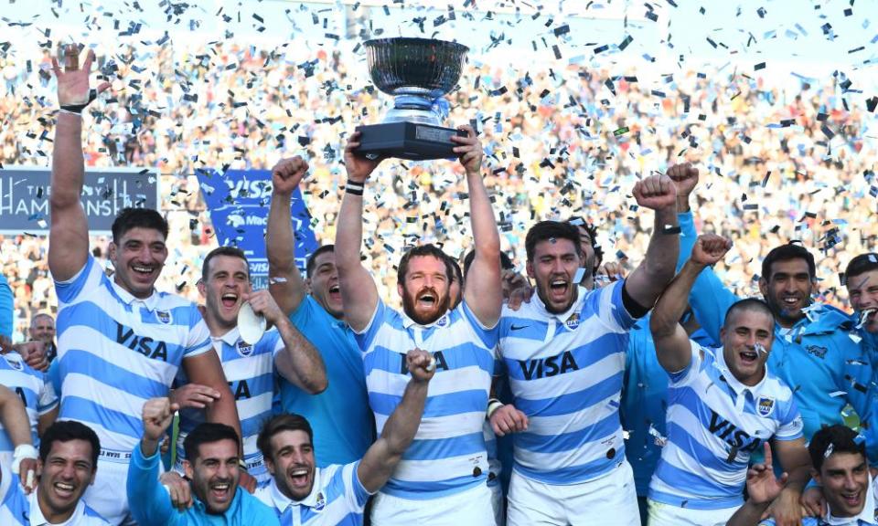 Julian Montoya of Argentina lifts the trophy with teammates after winning during a Rugby Championship match between Argentina Pumas and Australian Wallabies at San Juan del Bicentenario Stadium