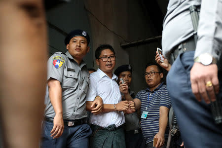 Reuters journalist Wa Lone departs Insein court after his verdict announcement in Yangon, Myanmar, September 3, 2018. REUTERS/Ann Wang/Files