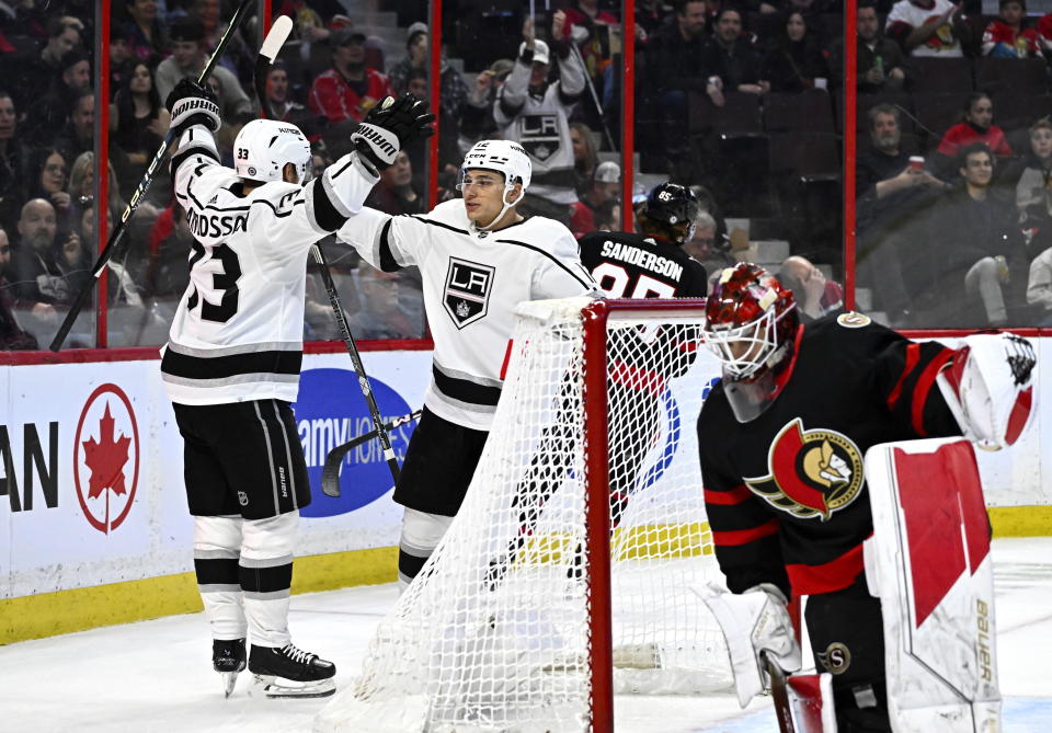 Los Angeles Kings right wing Viktor Arvidsson celebrates his goal with left wing Trevor Moore (12) as Ottawa Senators goaltender Cam Talbot stands up, during the first period of an NHL hockey game, Tuesday, Dec. 6, 2022, in Ottawa, Ontario. (Justin Tang/The Canadian Press via AP)