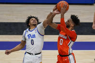 Pittsburgh's Ithiel Horton, left, blocks a shot by Syracuse's Alan Griffin during the second half of an NCAA college basketball game, Saturday, Jan. 16, 2021, in Pittsburgh. Pittsburgh won 96-76. (AP Photo/Keith Srakocic)