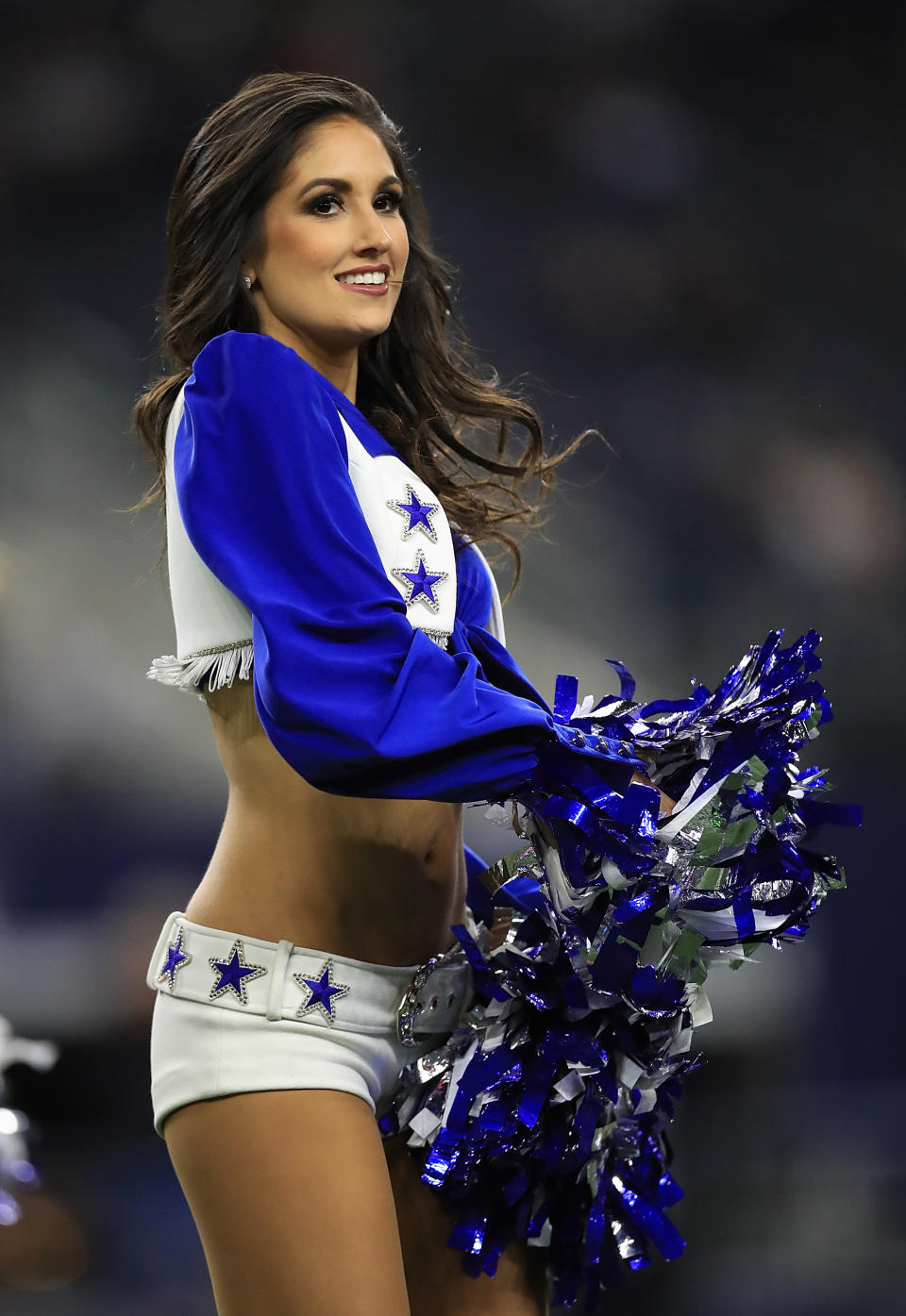 <p>A Dallas Cowboys Cheerleader performs at AT&T Stadium on November 19, 2017 in Arlington, Texas. (Photo by Ronald Martinez/Getty Images) </p>