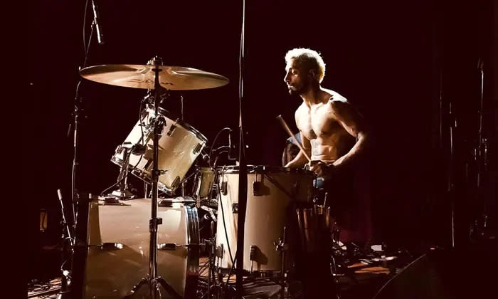  Riz Ahmed sitting at a drumkit in Sound of Metal. 