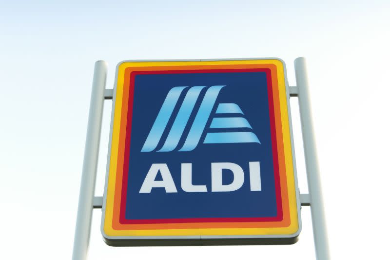 The Aldi logo on a sign outside an Aldi store.