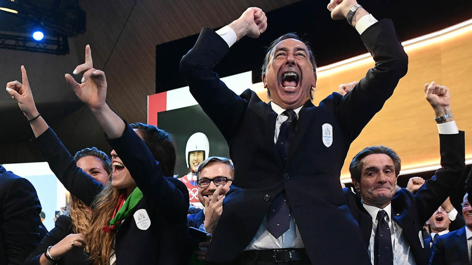 Mayor of Milan Giuseppe Sala and members of the delegation of Milan/Cortina celebrate. (Photo by PHILIPPE LOPEZ/AFP/Getty Images)