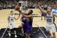 Phoenix Suns small forward T.J. Warren (12) shoots the ball past San Antonio Spurs shooting guard Manu Ginobili (20) during the first half at AT&T Center. Mandatory Credit: Soobum Im-USA TODAY Sports