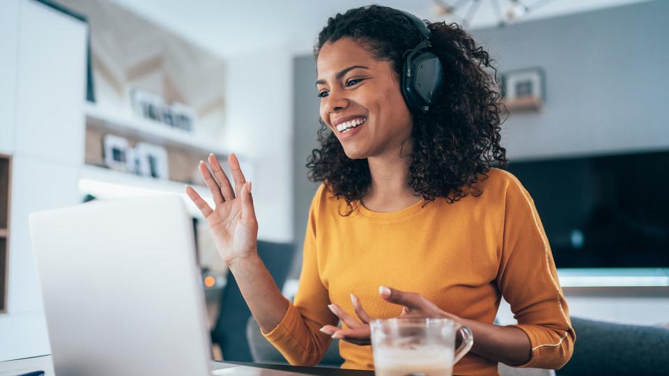 Young modern woman having Video Conference at home.