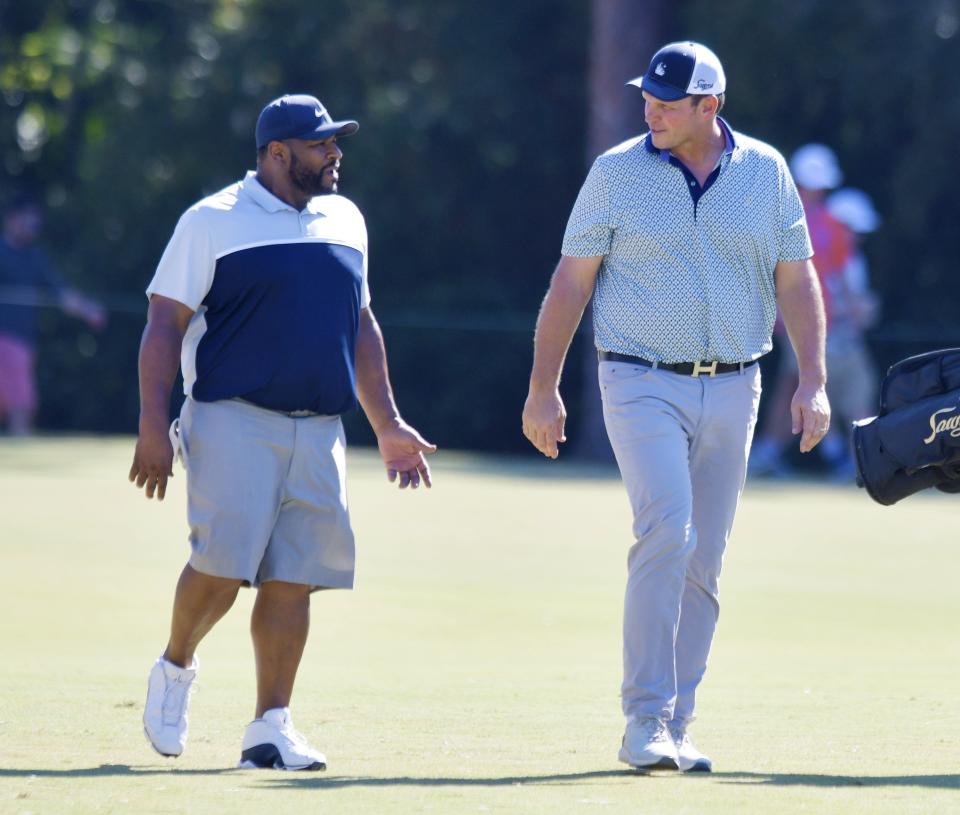 NFL Hall of Fame members Jerome Bettis and Tony Boselli talk as they walk down the fairway during the charity match which had Bettis and Ben Roethlisberger teamed up against Tony Boselli and Josh Scobee as part of the Constellation Furyk & Friends golf tournament at the Timuquana Country Club in Jacksonville, FL Friday, October 7, 2022. [Bob Self/Florida Times-Union]