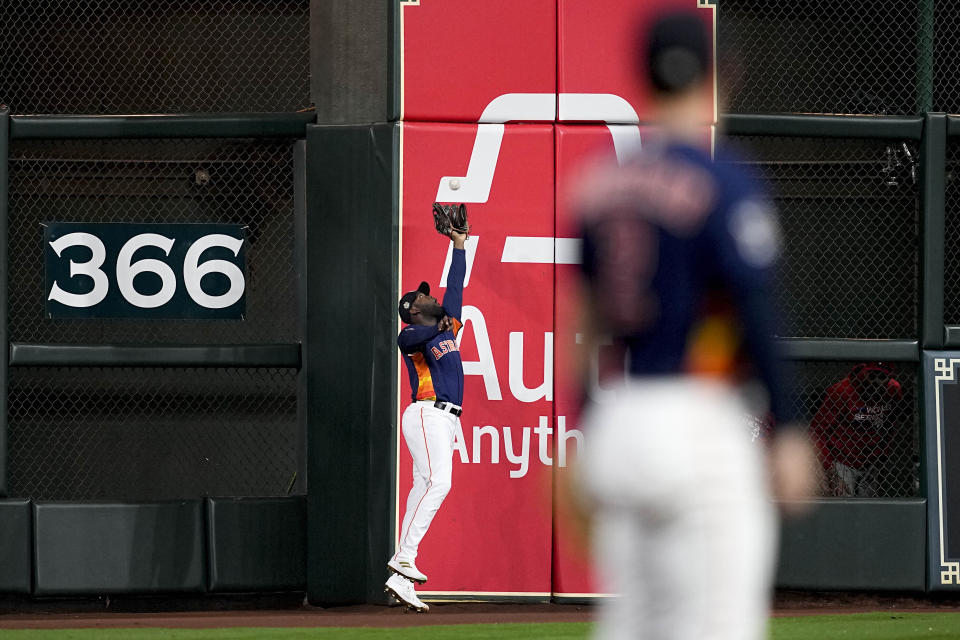 Houston Astros left fielder Yordan Alvarez catches a fly ball hit by Philadelphia Phillies' Edmundo Sosa during the second inning in Game 6 of baseball's World Series between the Houston Astros and the Philadelphia Phillies on Saturday, Nov. 5, 2022, in Houston. (AP Photo/Tony Gutierrez)