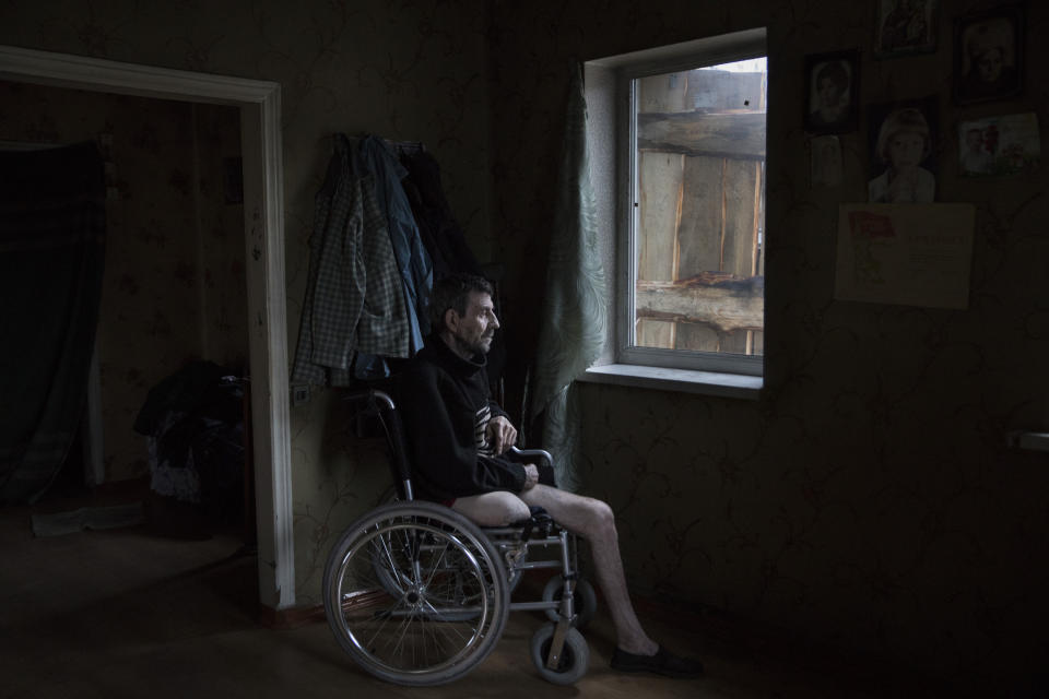 <span class="s1">Vladimir Mamoshyn, age 65, lives alone in the village of Avdiivka, about half a mile from the contact line where daily shelling and gunfire can be heard. His wife died in 2010 and his children abandoned him. In 2016, Vladimir lost his leg due to a vascular disease; the area has poor access to health care. After having a heart attack in 2017, he lost the use of his left hand. He now must use a wheelchair and depends on family and friends to help him. (Photograph by Paula Bronstein)</span>