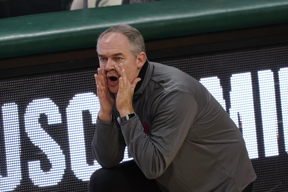 Rutgers head coach Steve Pikiell yells from the sideline during the first half of an NCAA college basketball game against Michigan State, Tuesday, Jan. 5, 2021, in East Lansing, Mich. (AP Photo/Carlos Osorio)