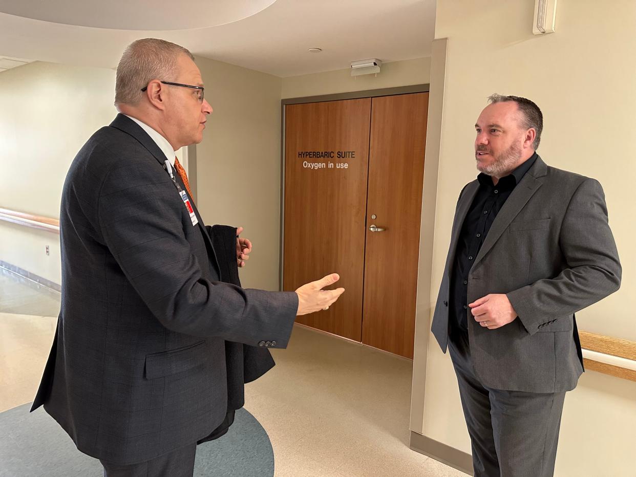 Hillsdale Hospital President and CEO JJ Hodshire, left, and Brandon Fewins, Michigan state director of U.S. Department of Agriculture Rural Development, visit the hospital's Center for Advanced Wound Care and Hyperbaric Medicine on Tuesday.
