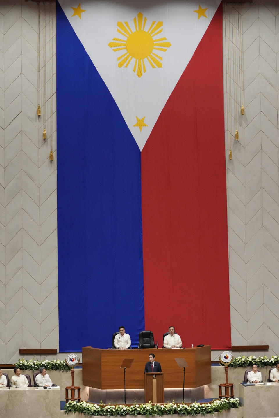 Japan's Prime Minister Fumio Kishida, the first Japanese premier to address a special joint session of the Philippine congress, delivers his speech at the House of Representative in Quezon city, Philippines on Saturday, Nov. 4, 2023. The leaders of Japan and the Philippines agreed Friday to start negotiations for a key defense pact that would allow their troops to enter each other's territory for joint military exercises. (AP Photo/Aaron Favila, Pool)