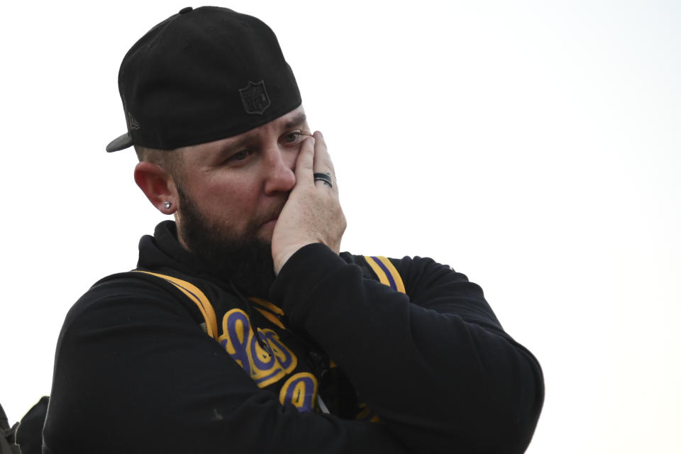 Anthony Hauk stands near the scene of a helicopter crash that killed former NBA basketball player Kobe Bryant in Calabasas, Calif., Sunday, Jan. 26, 2020. (AP Photo/Kelvin Kuo)