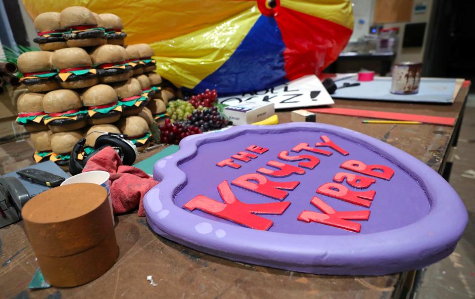 Props for "The SpongeBob Musical" include Krabby Patties from Bikini Bottom's iconic restaurant, The Krusty Krab.