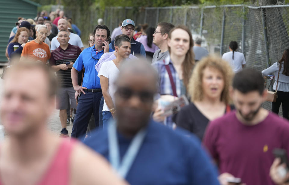 People wait in line outside West Grey Multi-Service Center on Election Day, Nov. 8, 2022, in Houston. Various problems in last November’s midterm elections will be center stage in a civil trial beginning Tuesday, Aug 1, 2023. (Melissa Phillip/Houston Chronicle via AP)