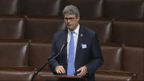 FILE - In this April 23, 2020, image from video, Rep. Bill Huizenga, R-Mich., speaks on the floor of the House of Representatives at the U.S. Capitol in Washington. Huizenga tweeted Wednesday, Oct. 14 that he tested positive for COVID-19 in a rapid test before he was scheduled to appear at a Michigan campaign rally with Vice President Mike Pence. (House Television via AP, File)