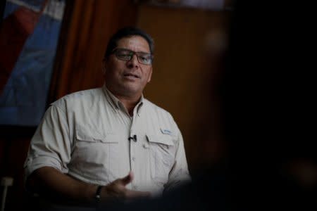 FILE PHOTO: Enio Cubillo, Director of the Civil Aviation Authority, speaks during an interview with Reuters about the details of the investigation into the crash that killed two pilots and 10 U.S. tourists last week, in San Jose, Costa Rica January 4, 2018. REUTERS/Juan Carlos Ulate