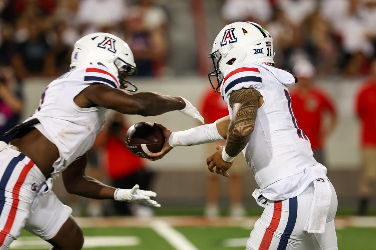 Aug 31, 2024; Tucson, Arizona, USA; Arizona Wildcats quarterback Noah Fifita (11) hands the ball off during third quarter at Arizona Stadium. Mandatory Credit: Aryanna Frank-USA TODAY Sports