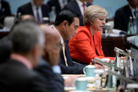 British Prime Minister Theresa May, right, attends the opening ceremony of the G20 Summit in Hangzhou in eastern China's Zhejiang province, Sunday, Sept. 4, 2016. 4, 2016. REUTERS/Mark Schiefelbein/Pool