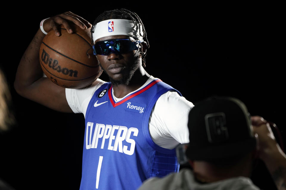 Los Angeles Clippers guard Reggie Jackson (1) poses for photos during the NBA basketball team's Media Day, Monday, Sept. 26, 2022, in Los Angeles (AP Photo/Marcio Jose Sanchez)