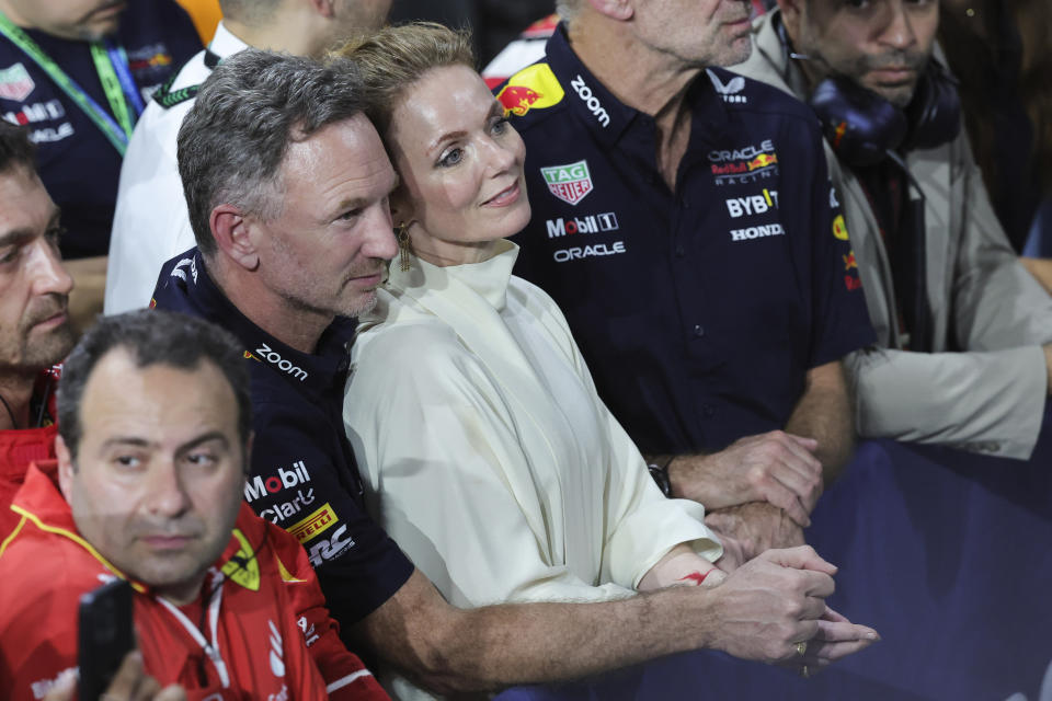 Red Bull team principal Christian Horner is flanked by his wife Geri Alliwell after the Formula One Saudi Arabian Grand Prix at the Jeddah Corniche Circuit, in Jedda, Saudi Arabia, Saturday, March 9, 2024. (AP Photo/Giuseppe Cacace/Pool)