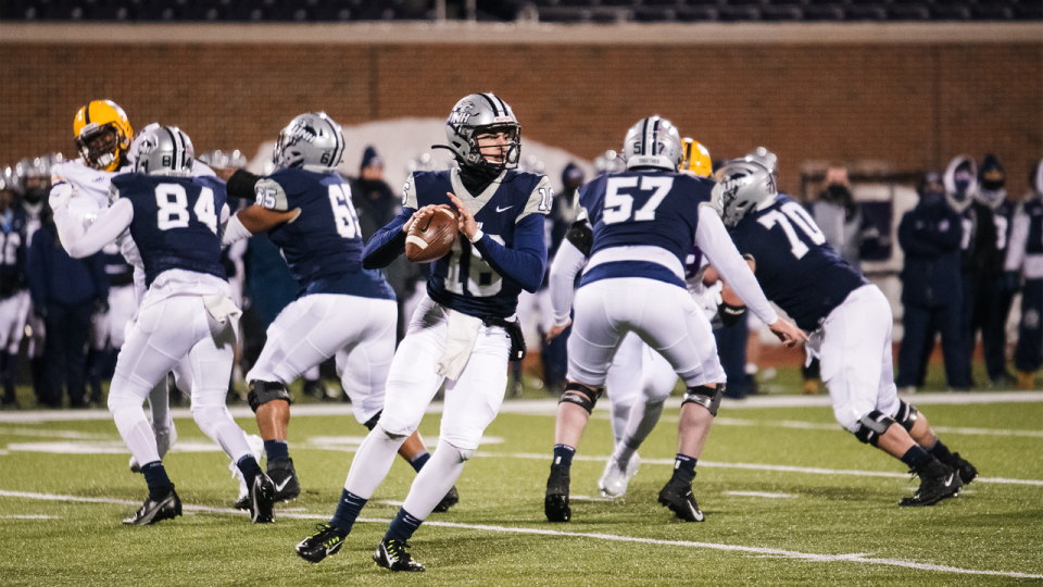 University of New Hampshire quarterback Max Brosmer looks for a receiver against Albany in March 2021. Brosmer missed the entire 2021 fall season with a knee injury. Brosmer went 6-5 in his freshman season of 2019 and is poised to lead the Wildcats back to the top of the Colonial Athletic Association standings this fall.