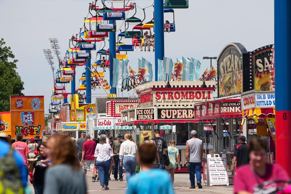 Visitors ride the SkyGlider over the WNCI Food Highway at this summer's Ohio State Fair.