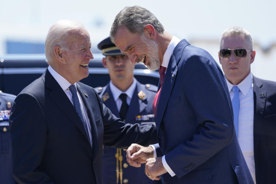 President Joe Biden talks with Spain's King Felipe VI as he arrives at Madrid's Torrejon Airport, Tuesday, June 28, 2022. Biden is in Spain to attend the North Atlantic Treaty Organization summit. (AP Photo/Susan Walsh)