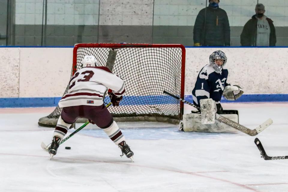 Nantucket goaltender Griffen Starr can only look as Bishop Stang's Justin Gouveia is about to knock home his second goal of the game for the Spartans. Gouveia would score all three Bishop Stang goals.