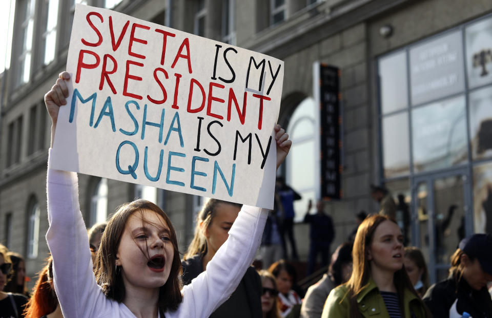 Women attend an opposition rally to protest the official presidential election results in Minsk, Belarus, Saturday, Sept. 12, 2020. Daily protests calling for the authoritarian president's resignation are now in their second month and opposition determination appears strong despite the detention of protest leaders. (Tut.by via AP)