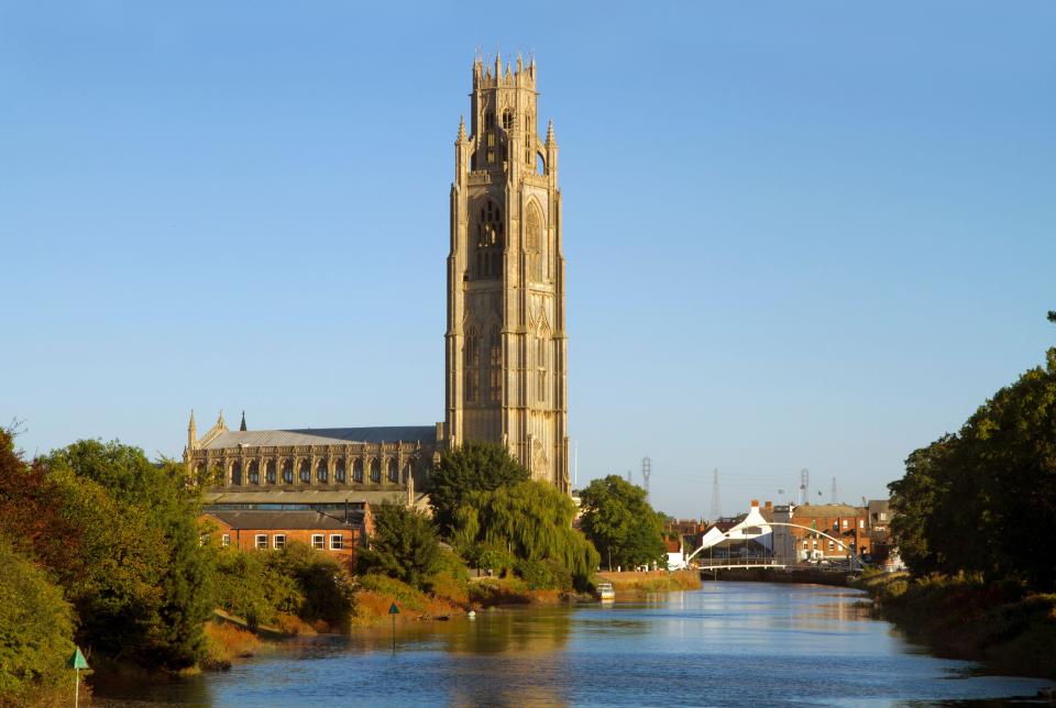 The spire of St Botolph's Church in Boston, Lincolnshire, also refered to as the “Boston Stump” with the River Witham navigation in the foreground.