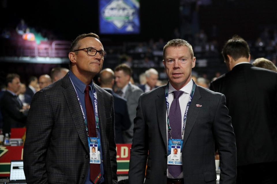 Steve Yzerman and Kris Draper of the Detroit Red Wings attend the NHL draft at Rogers Arena on June 22, 2019 in Vancouver.