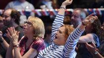 Hilary Clinton supporters react to some better news at the Sydney US election party. Photo: AAP